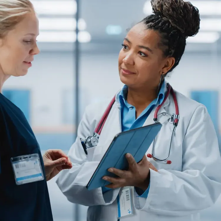 Public Health Nurses Discussing Patient Charts